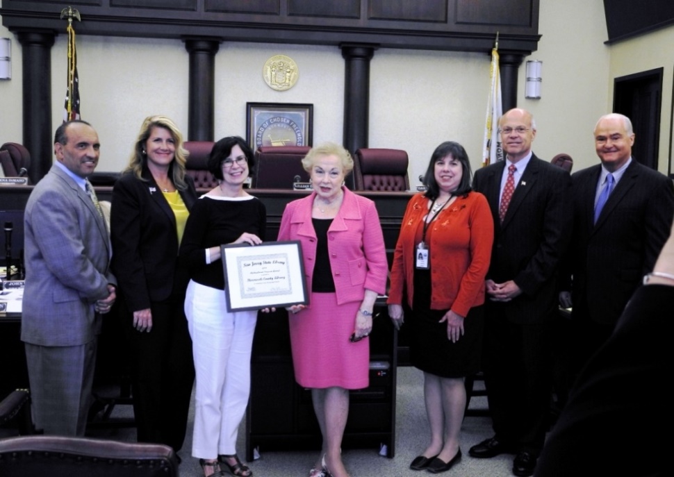 The Monmouth County Board of Freeholders recently honored the Monmouth County Library for their New Jersey State Library Multicultural Award for its participation in The Big Read program in 2013. (From left to right): Freeholder Thomas Arnone, Freeholder Serena DiMaso, Monmouth County Library Program Coordinator Donna Mansfield, Freeholder Director and Library Liaison Lillian Burry, Acting Library Director Judith Tolchin, Freeholder Deputy Director Gary Rich, Sr., and Freeholder John Curley.